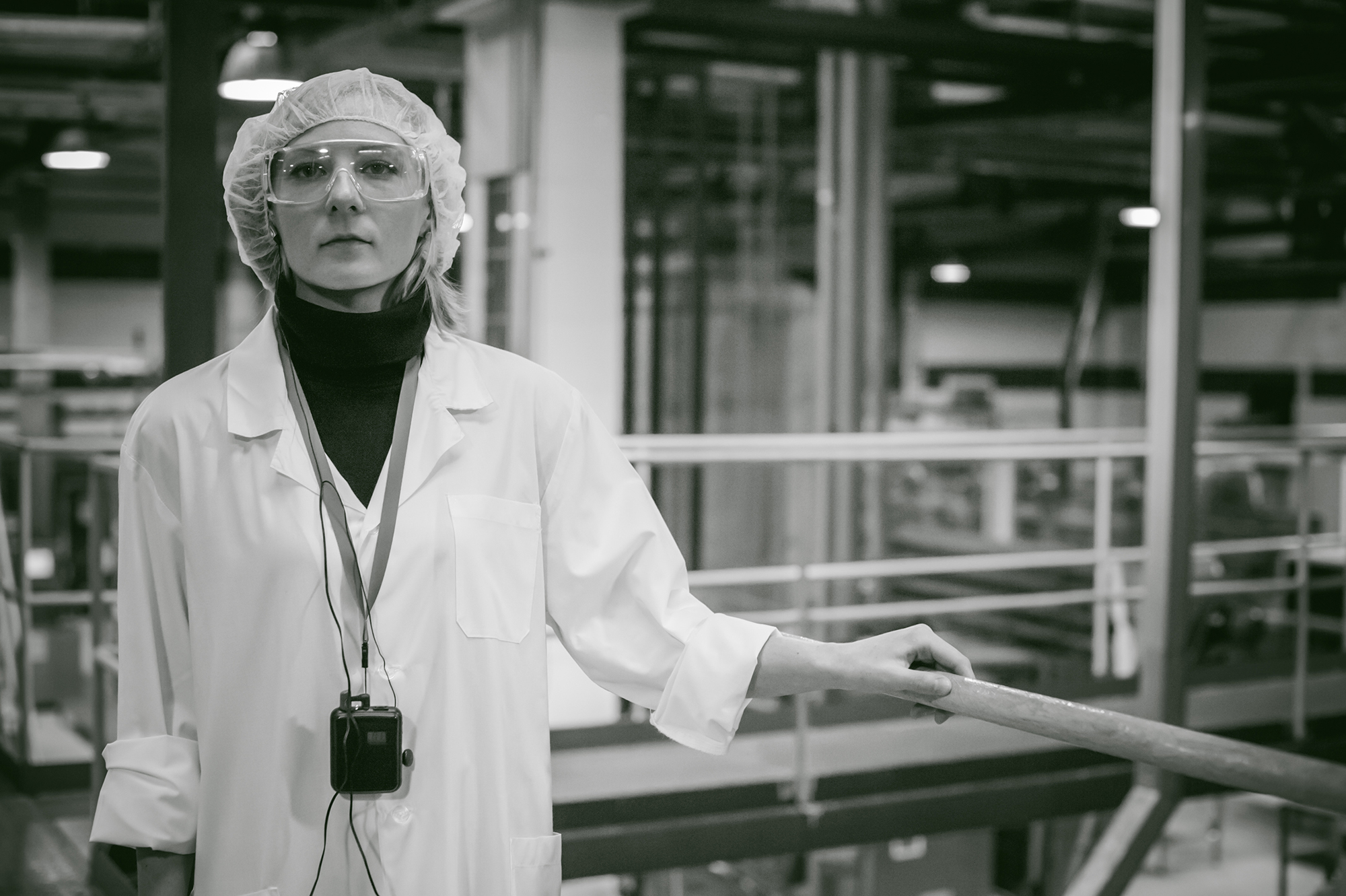Female worker on the production line of beer factory. portrait o